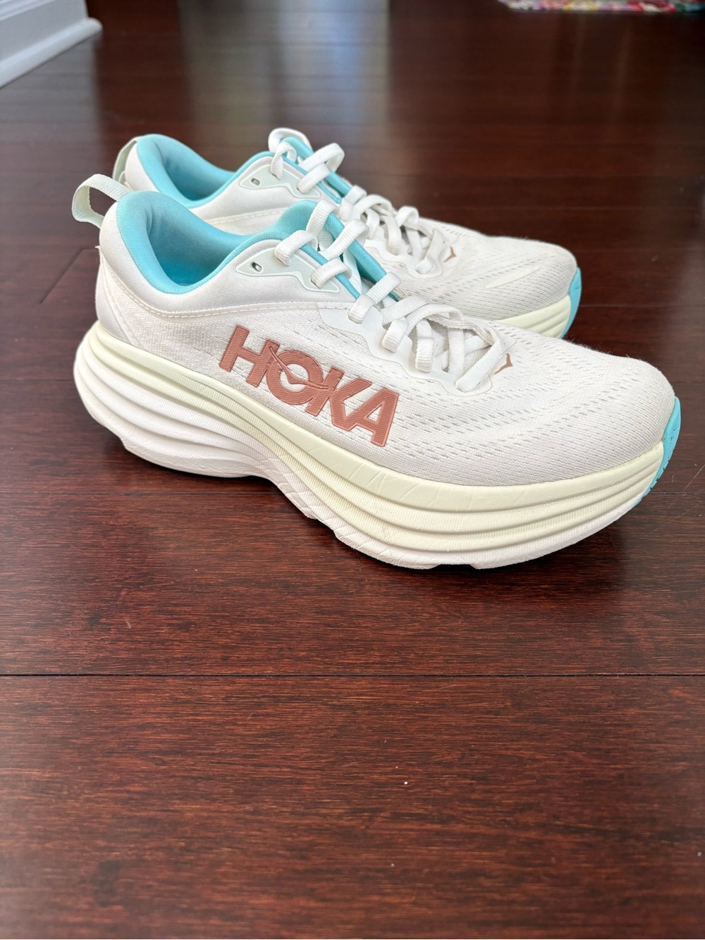 Hoka Bondi 8 Women's White Shoes with Turquoise Lining and Rose Gold Logo